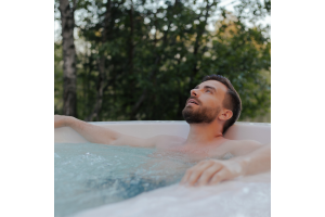 Man relaxing in a Crystec Spas hot tub in Cyprus
